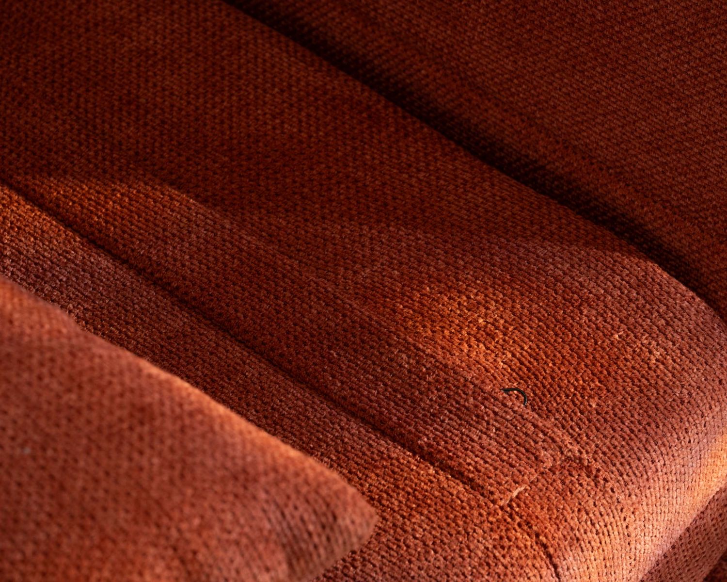 Poltrona di design scandinavo in tessuto terracotta "Folda" trasformabile in letto occasionale