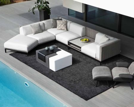 Divano grande "Saparua Island" con chaise longue e ripiano in pietra